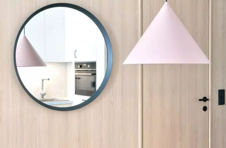 round mirrors optically enlarge the space