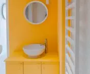 Yellow color is repeated in the bathroom