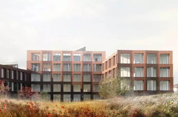 The facades of the building are formed by slightly stepped massive brick frames with large windows