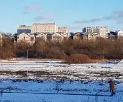 Panorama of the east bank of the Warta River in the center. 