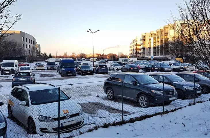 A section of the old bed of the Warta River used as a parking lot. 