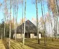 The sloping roof of the house is covered with aspen chips