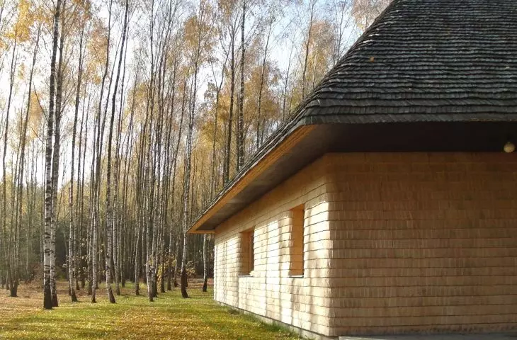 The facade of the house is covered with wood