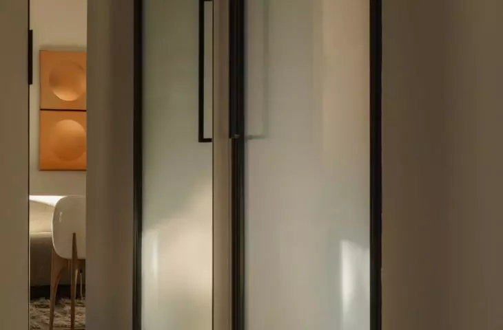 tall steel doors with frosted glass were created especially for this interior