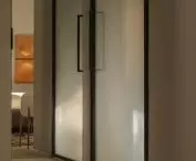 tall steel doors with frosted glass were created especially for this interior