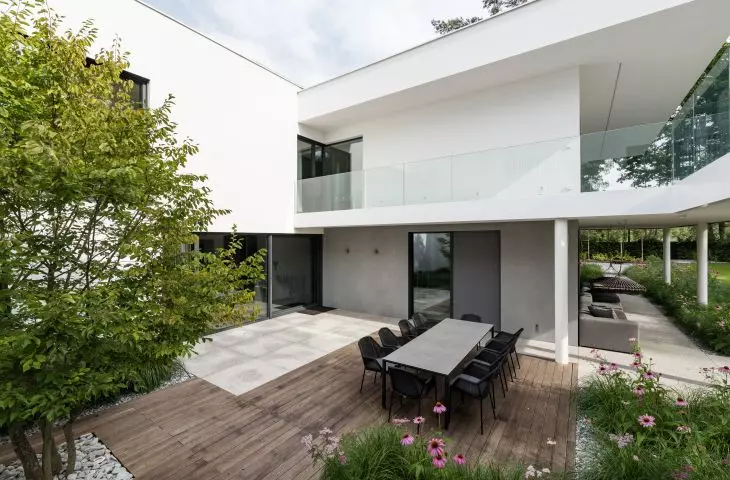 The house is surrounded by greenery