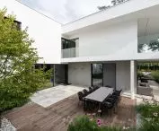 The house is surrounded by greenery