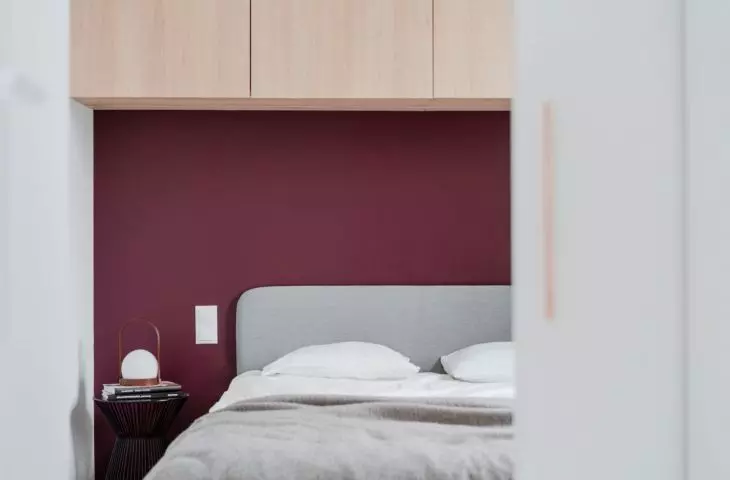 maroon wall in the bedroom