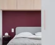maroon wall in the bedroom