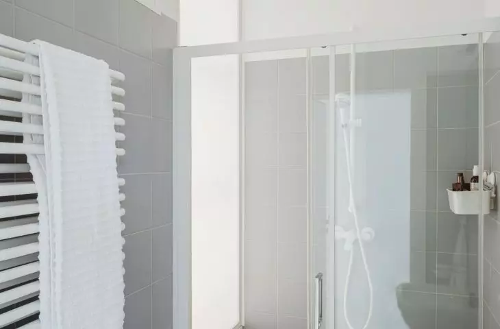 The bathroom is illuminated by glass in the shower area