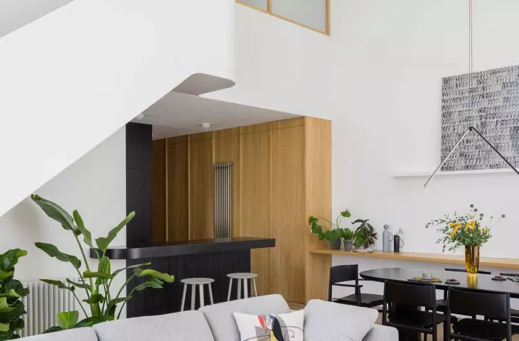 Lodz apartment consists of a high, spacious living area and a mezzanine floor
