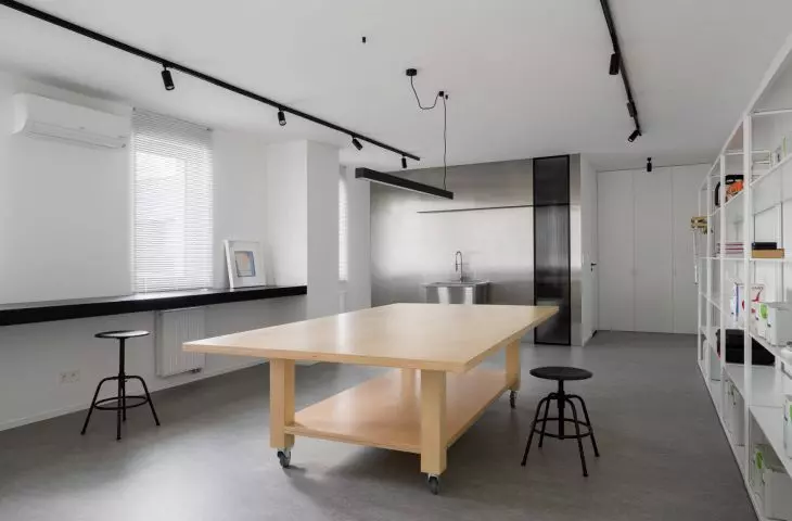 The mezzanine floor houses the investor's austere but functional studio