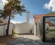 A communist-era extension with a distinctive large chimney 