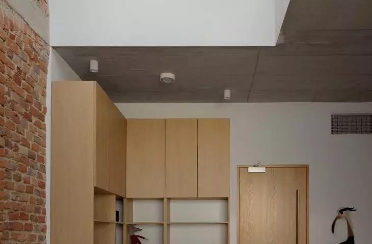 glazing between the halls gives a glimpse into inaccessible nooks and crannies