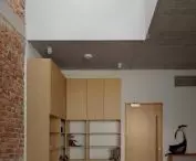 glazing between the halls gives a glimpse into inaccessible nooks and crannies