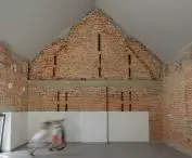 attic with exposed brick 