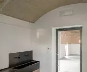 common room vestibule with space for a sink and toilet