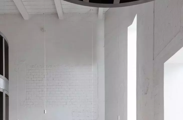 light interior is filled with dark wood structure