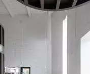 light interior is filled with dark wood structure