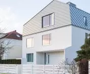 The mansard roof crowning the house is perversely skewed