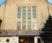 Former synagogue - front, visible inscription after the municipal swimming pool and elements of the original facade peeking out from under the plaster