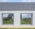 large glazing brings daylight into the interiors and frames views of the garden