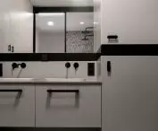 space with two sinks and a washing machine