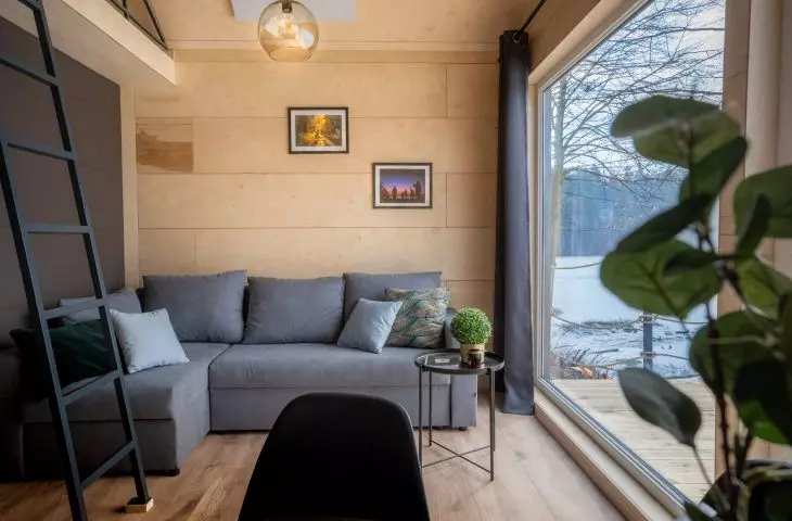 buildings open up to the landscape through large balcony windows on the side of terraces