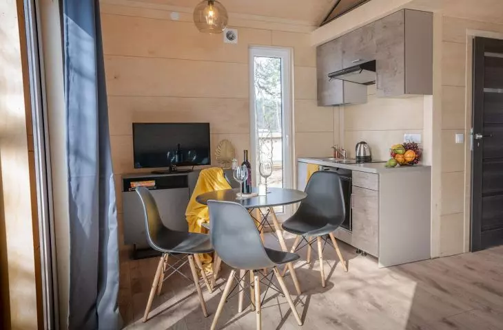 walls in the interiors are clad in light wood
