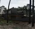 RE: REDWOOD HOUSE inscribed in forest surroundings