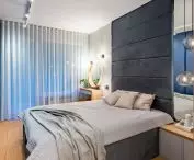 Comfortable bed with upholstery in the bedroom