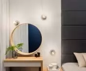 Toilet with round mirror in the bedroom