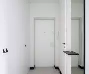 White visually enlarges the hallway