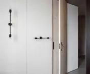A bright cubicle hides a bedroom, among other things