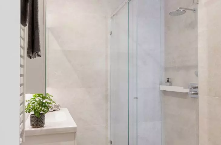 Bright bathroom with imitation oak flooring
