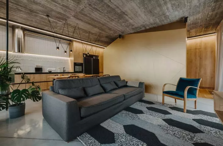 in a somewhat austere living space, the eye is attracted by a sizable sculpted body