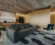 in a somewhat austere living space, the eye is attracted by a sizable sculpted body
