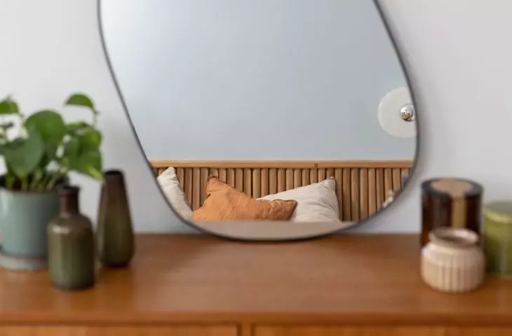 The unformed shape of the mirror makes the interior seem a bit surreal 