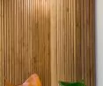 Oak laths in the lobby act as tasteful paneling