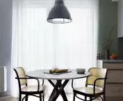 MInijadalnia in a room that serves as a dining room, kitchen, living room and workspace