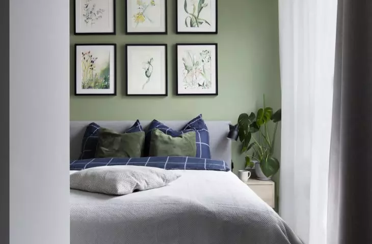 The tranquil space of the bedroom is enlivened by graphicsi by Ilona Palenchuk