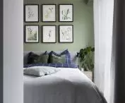 The tranquil space of the bedroom is enlivened by graphicsi by Ilona Palenchuk