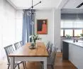 Minimalist lamp over the table gives the interior a modern touch 