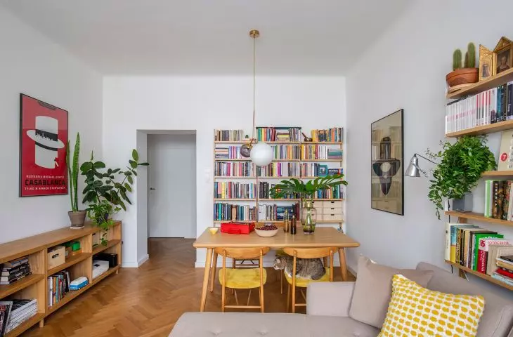 The living room is filled with books