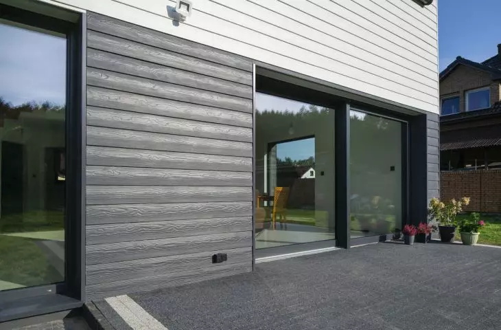 Single-family house in Walcz covered with Cedral LAP WOOD board in two contrasting colors