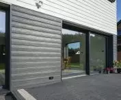 Single-family house in Walcz covered with Cedral LAP WOOD board in two contrasting colors