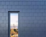 Facade of modular house by ABZ Modular Wooden Homes covered with CEDRAL tile in graphite color (double covering)