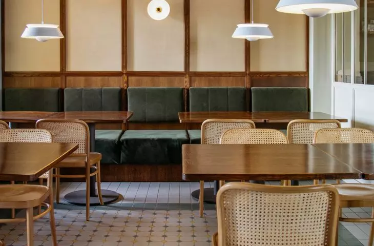 the interior is dominated by deep green and sandy beige