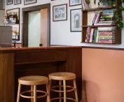 old photographs hang on the wall behind the bar