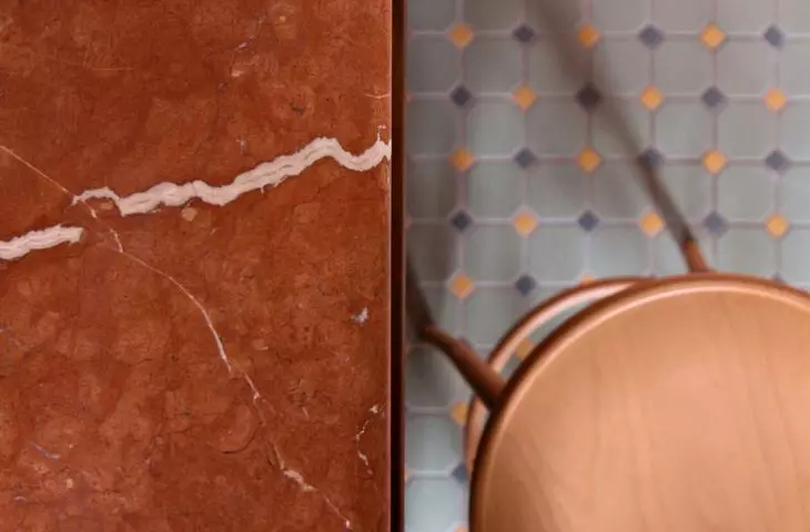 the bar top is made of stone in the color of flamed pink